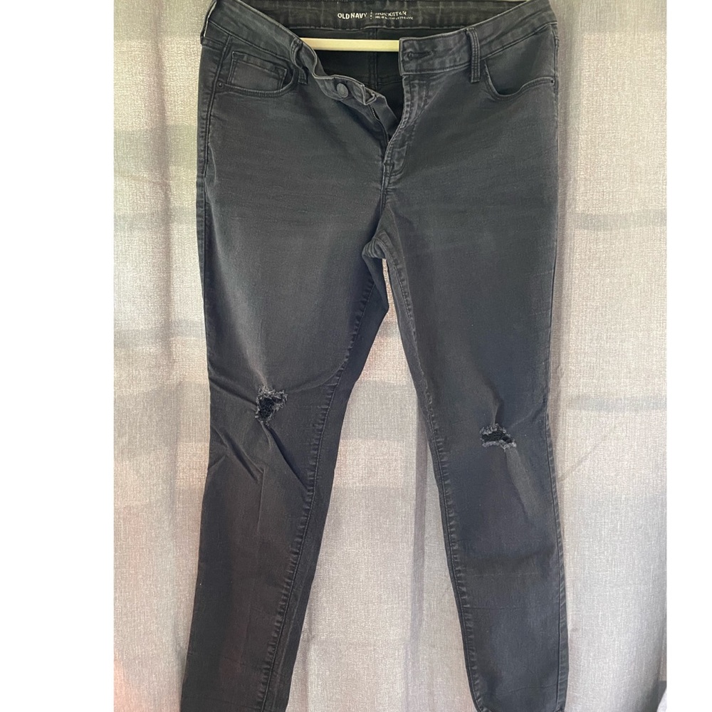 Distressed black jeans.